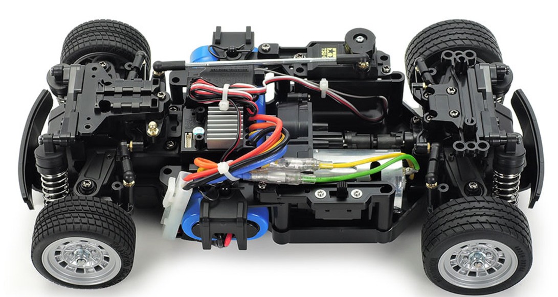 RC car chassis with visible wiring, motor, and wheels, showcasing intricate internal components.