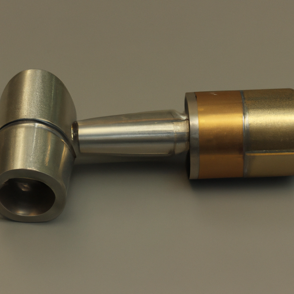 Metallic industrial object with cylindrical components and connectors on a neutral background.