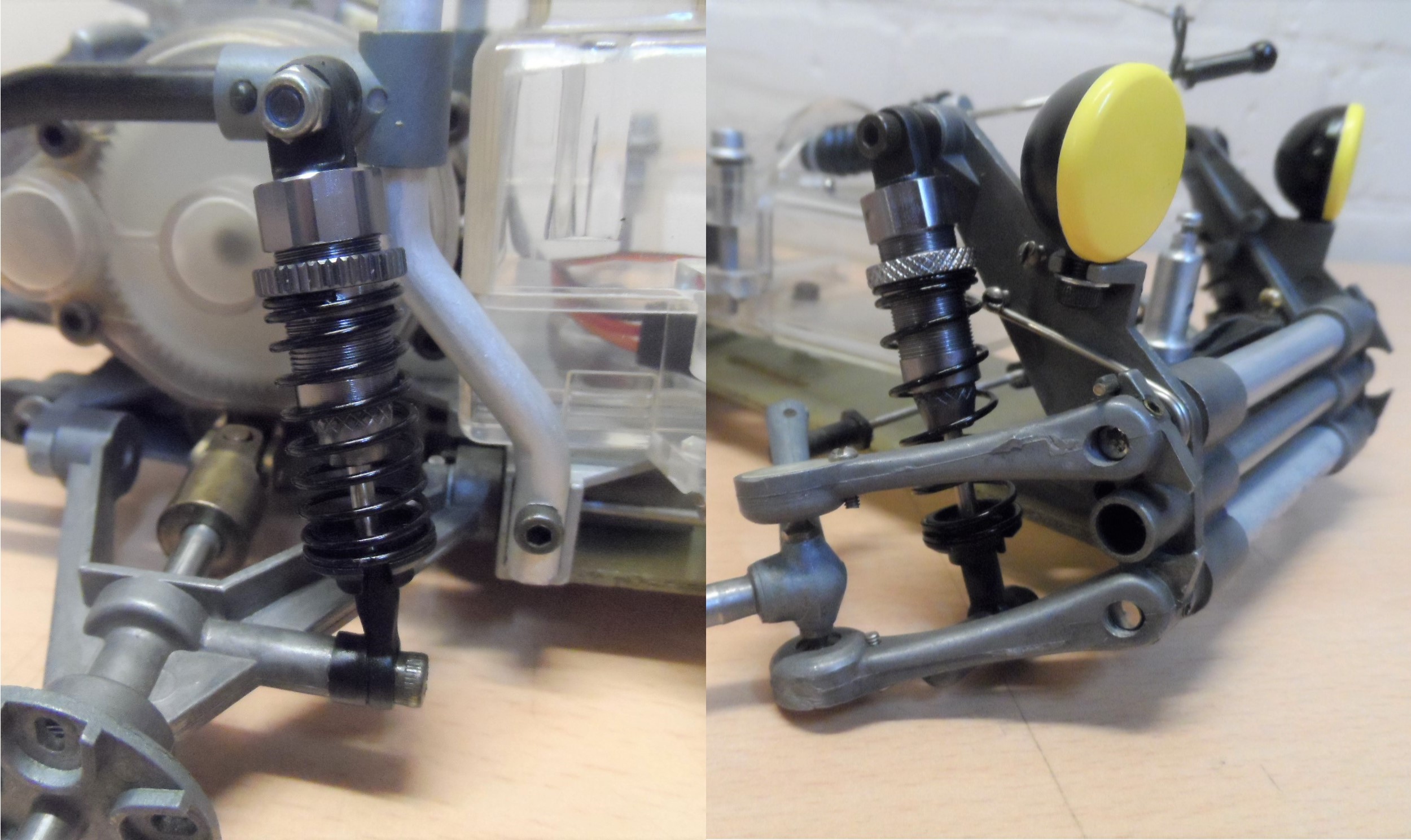 Close-up of RC car suspension system and shock absorbers, highlighting mechanical details and components.