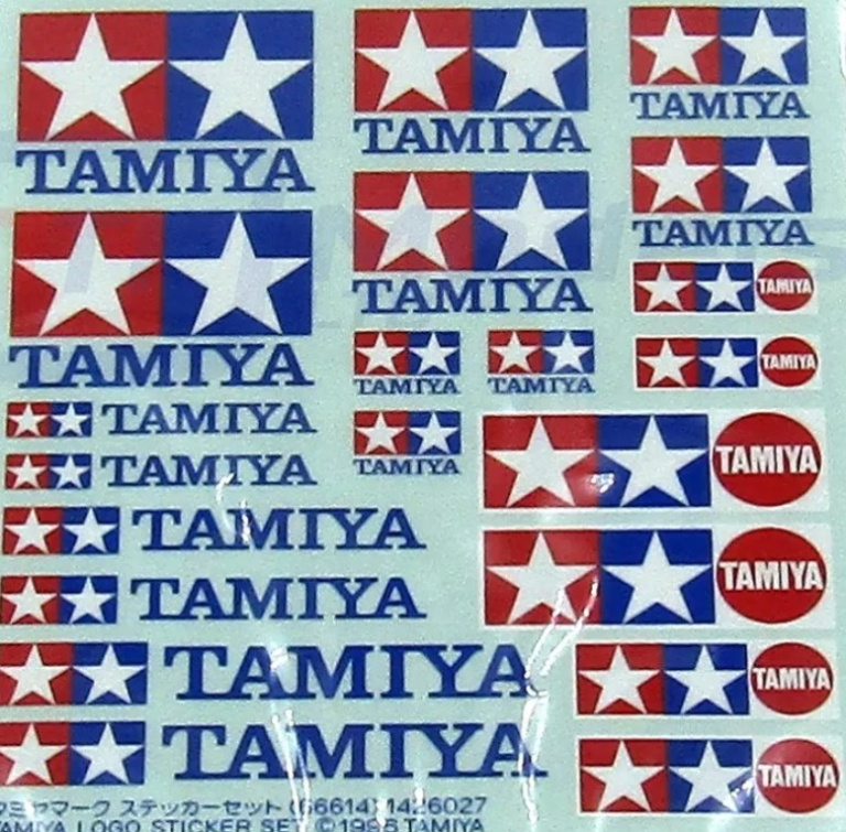 Tamiya logo stickers featuring red, white, and blue stars with text on a transparent background.