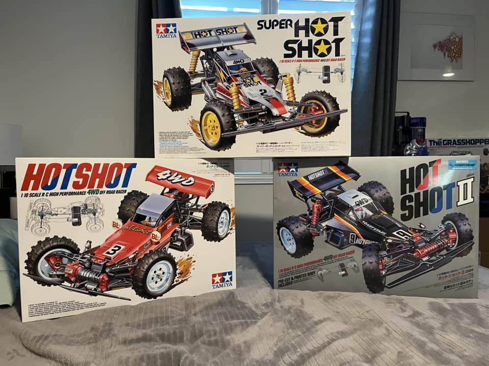 Tamiya Hotshot series model boxes displayed, featuring vintage 4WD off-road RC cars.